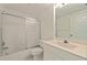 The bathroom features a shower-tub combo and vanity with ample counter space at 402 Laurel Lake Dr # 104, Venice, FL 34292