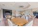 Spacious clubhouse featuring multiple seating areas, a TV and plenty of room for activities and entertainment at 402 Laurel Lake Dr # 104, Venice, FL 34292