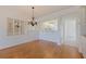 Inviting dining room with chandelier, seamlessly connects to the kitchen at 402 Laurel Lake Dr # 104, Venice, FL 34292