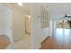 Hallway leading to the bathroom and living room, with built-in cabinets for extra storage at 402 Laurel Lake Dr # 104, Venice, FL 34292