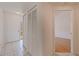 Entryway featuring tiled floors, a closet, and a view into the living space at 402 Laurel Lake Dr # 104, Venice, FL 34292