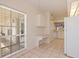 Kitchen area features a breakfast nook/office with a built-in desk and storage at 402 Laurel Lake Dr # 104, Venice, FL 34292