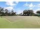 Community tennis courts with vibrant green surface and neatly marked lines on a sunny day at 402 Laurel Lake Dr # 104, Venice, FL 34292