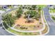Aerial view of neighborhood park featuring playground, slide and basketball court in a cul-de-sac at 4094 Windcrest Dr, Wesley Chapel, FL 33544