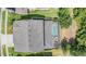 An aerial view shows the layout of the backyard pool and spa area at 4094 Windcrest Dr, Wesley Chapel, FL 33544