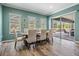 Light-filled dining room with sliding door access to the outdoor patio at 4094 Windcrest Dr, Wesley Chapel, FL 33544