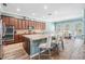 Gourmet kitchen with granite countertops, stainless steel appliances, and seating at the kitchen island at 4094 Windcrest Dr, Wesley Chapel, FL 33544
