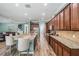 Gourmet kitchen with granite countertops, stainless steel appliances, and breakfast bar seating at 4094 Windcrest Dr, Wesley Chapel, FL 33544