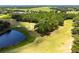 Aerial view of the community's golf course and pond at 4260 Baudelaire Ct, Brooksville, FL 34604