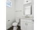 Stylish half bath features a modern vanity with quartz counters and a new toilet at 4260 Baudelaire Ct, Brooksville, FL 34604
