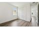 Neutral bedroom with closet and hardwood floors; light and bright at 4260 Baudelaire Ct, Brooksville, FL 34604