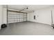 Spacious garage features sealed flooring and an automatic door at 4260 Baudelaire Ct, Brooksville, FL 34604