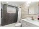 Stylish bathroom with modern tiles, new showerhead, and white vanity at 4545 Annette St, New Port Richey, FL 34652
