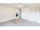 A bright and open bedroom with a closet and neutral carpet at 4545 Annette St, New Port Richey, FL 34652