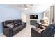 Comfortable living room with plush seating, ceiling fan, and modern decor for relaxation at 4545 Annette St, New Port Richey, FL 34652