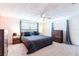 Spacious bedroom with large windows, ceiling fan, and neutral decor to create a peaceful atmosphere at 4545 Annette St, New Port Richey, FL 34652