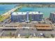Condo building with nearby beach access, boat dock, and ample parking for residents and guests at 500 Treasure Island Cswy # 607, Treasure Island, FL 33706