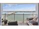 Inviting balcony showcasing seating, a table and spectacular bridge and water views at 500 Treasure Island Cswy # 607, Treasure Island, FL 33706