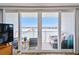Balcony view through sliding glass doors revealing waterfront views with outdoor seating at 500 Treasure Island Cswy # 607, Treasure Island, FL 33706