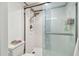 Clean bathroom with white tiled shower and glass doors showcasing a modern and functional design at 500 Treasure Island Cswy # 607, Treasure Island, FL 33706