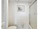 This is a clean half bathroom with hard floors and neutral paint at 500 Treasure Island Cswy # 607, Treasure Island, FL 33706
