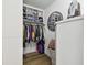 Walk-in closet with a variety of storage solutions, shelving, hanging rods and clothing at 500 Treasure Island Cswy # 607, Treasure Island, FL 33706