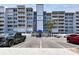 Coastal condo featuring ample parking, waterfront access, and a well-maintained exterior at 500 Treasure Island Cswy # 607, Treasure Island, FL 33706