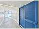 Hallway with water views, tiled floors, and a solid wood door at 500 Treasure Island Cswy # 607, Treasure Island, FL 33706