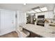 Bright kitchen featuring stainless appliances, granite counters, and ample cabinet space at 500 Treasure Island Cswy # 607, Treasure Island, FL 33706
