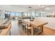 Spacious living room with wood floors, large windows, and access to a balcony at 500 Treasure Island Cswy # 607, Treasure Island, FL 33706