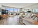 Comfortable living room with views, modern furniture, and a mirrored wall at 500 Treasure Island Cswy # 607, Treasure Island, FL 33706