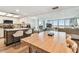 Open-concept living area with kitchen, dining, and water views at 500 Treasure Island Cswy # 607, Treasure Island, FL 33706