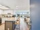 This open-concept kitchen and living area features wood floors, recessed lighting and large windows with water views at 500 Treasure Island Cswy # 607, Treasure Island, FL 33706