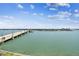 Expansive water view featuring a bridge and distant cityscape under a partly cloudy sky at 500 Treasure Island Cswy # 607, Treasure Island, FL 33706