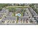 An aerial shot of homes surrounding a pool area with lush landscaping and walking trails at 5005 Blue Latan Ln, Tampa, FL 33610