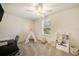 Cozy bedroom area including a teepee tent and shelving for toys, well-lit by a bright window at 5005 Blue Latan Ln, Tampa, FL 33610