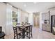 Cozy dining area with a modern table setting and plenty of natural light at 5005 Blue Latan Ln, Tampa, FL 33610