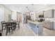Modern kitchen featuring stainless steel appliances, granite countertops, and a stylish island at 5005 Blue Latan Ln, Tampa, FL 33610
