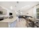 Bright open-concept living space with modern kitchen, dining area, and a cozy living room at 5005 Blue Latan Ln, Tampa, FL 33610