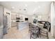 Open-concept living space with kitchen, dining area, and cozy living room, perfect for entertaining at 5005 Blue Latan Ln, Tampa, FL 33610