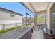 Spacious screened-in patio with views of the backyard and adjacent houses, perfect for relaxation at 5005 Blue Latan Ln, Tampa, FL 33610