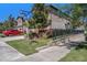 A charming street view shows the home's exterior with landscaped lawn and convenient street sign at 5005 Blue Latan Ln, Tampa, FL 33610