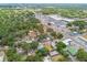 A sprawling aerial view of the neighborhood and a shopping center, highlighting the convenient location at 504 E Lee St, Plant City, FL 33563