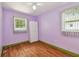 Bedroom showcasing two windows, a closet, and laminate flooring at 504 E Lee St, Plant City, FL 33563