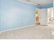 Spacious bedroom with white tile flooring and access to the bathroom at 504 E Lee St, Plant City, FL 33563