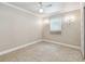 Neutral bedroom featuring tile floors, a ceiling fan, and window at 504 E Lee St, Plant City, FL 33563