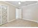 This bedroom features neutral walls, a ceiling fan, and tile floors at 504 E Lee St, Plant City, FL 33563