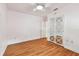 This bedroom has wood floors, a ceiling fan and a closet at 504 E Lee St, Plant City, FL 33563
