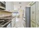 Open kitchen view with modern appliances, white cabinets, and a spacious layout at 504 E Lee St, Plant City, FL 33563