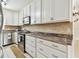 Kitchen with stainless steel appliances, granite countertops, and mosaic backsplash at 504 E Lee St, Plant City, FL 33563